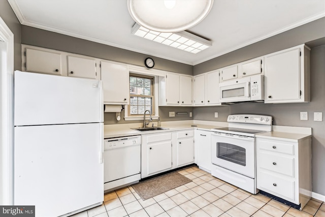 kitchen featuring white appliances, white cabinets, a sink, and light countertops