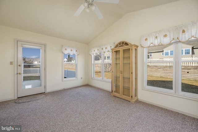 interior space featuring lofted ceiling and ceiling fan