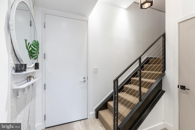 entryway with stairway and wood finished floors