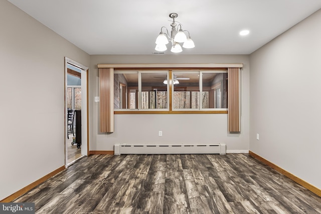 unfurnished dining area with a baseboard heating unit, dark wood-style flooring, a notable chandelier, and baseboards