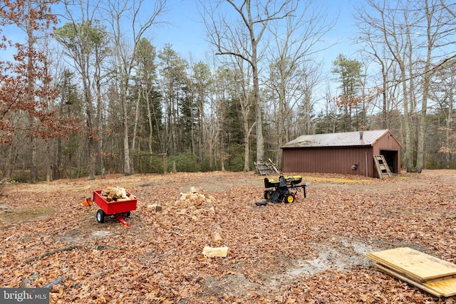 view of yard featuring an outbuilding and a pole building