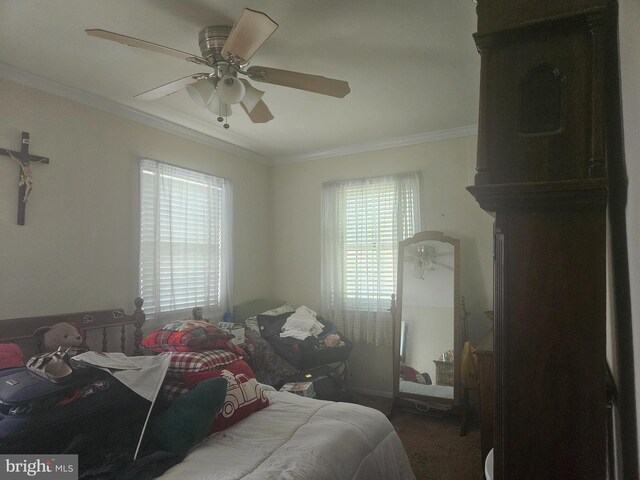 bedroom with crown molding and a ceiling fan