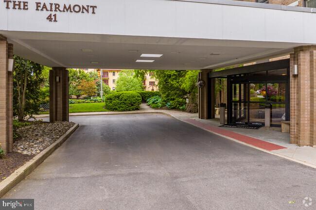 view of parking / parking lot with a carport