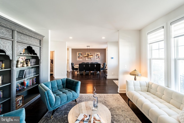 living area featuring baseboards, dark wood-style flooring, and recessed lighting