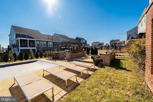 view of property's community with a residential view, outdoor dry bar, fence, a patio area, and a pergola