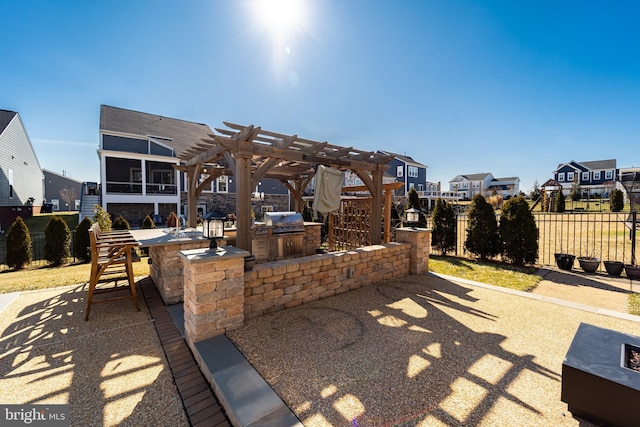 view of patio / terrace with fence, a pergola, and area for grilling