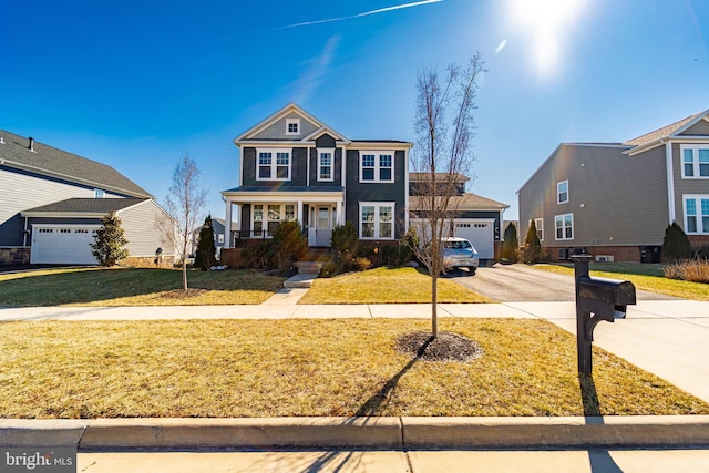 view of front of home featuring an attached garage, aphalt driveway, and a front yard