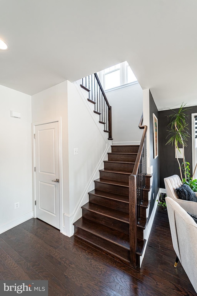 staircase with recessed lighting, hardwood / wood-style flooring, and baseboards