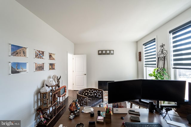 home office with wood finished floors