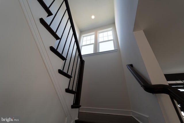 staircase with recessed lighting and baseboards