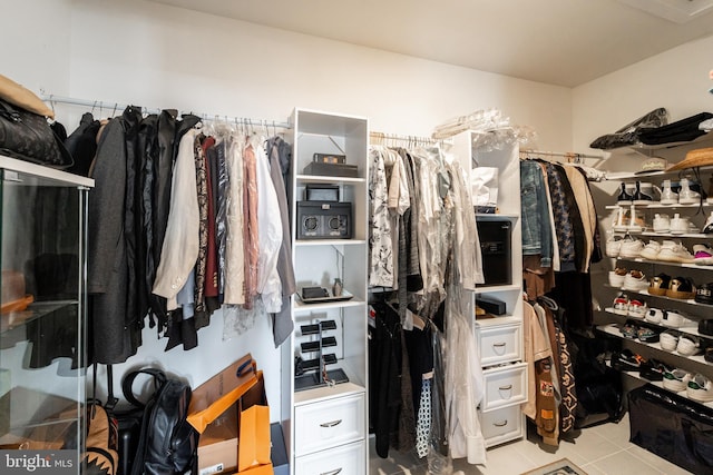 spacious closet featuring tile patterned floors