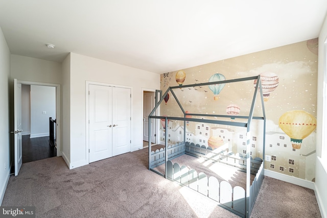 bedroom featuring carpet floors and baseboards