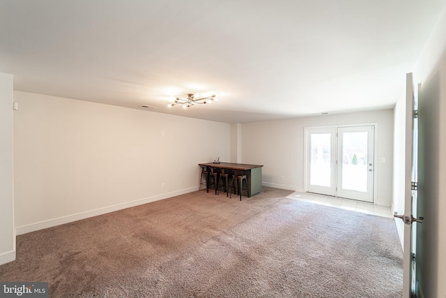 empty room with light carpet, baseboards, and visible vents