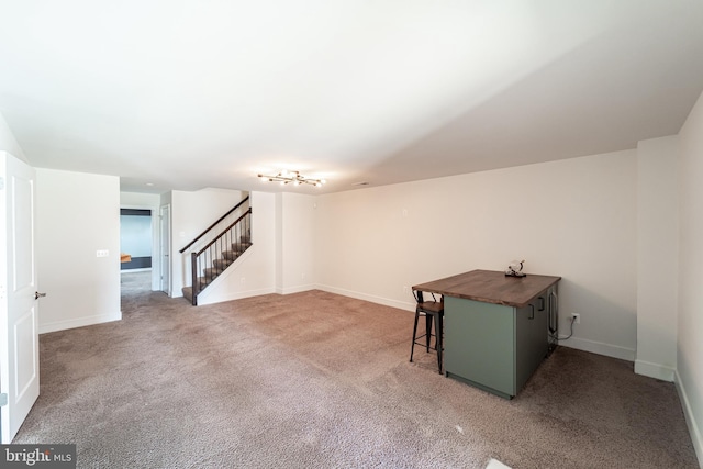 interior space featuring carpet, stairs, and baseboards