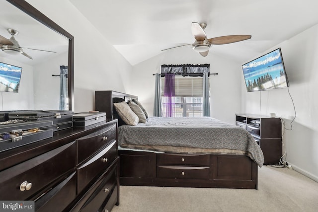 bedroom featuring vaulted ceiling, light carpet, and a ceiling fan