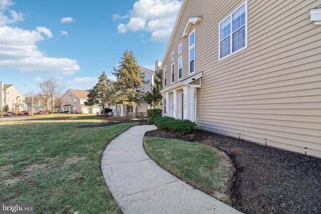 view of yard featuring a residential view