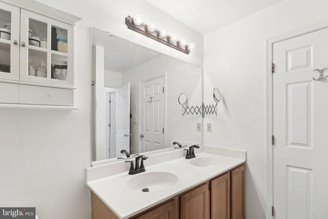 bathroom featuring double vanity and a sink