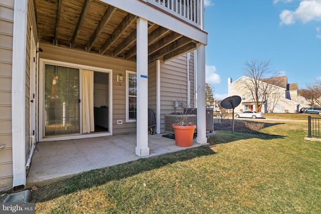 view of yard with central AC unit and a patio