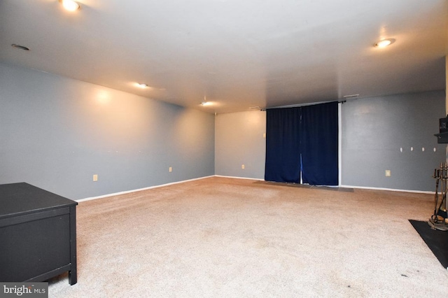 interior space with carpet and baseboards