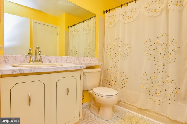 bathroom with tile patterned floors, toilet, and vanity