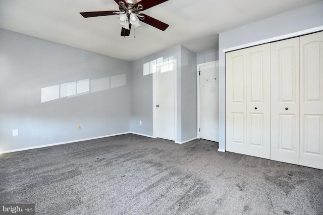 unfurnished bedroom with carpet, baseboards, a closet, and ceiling fan