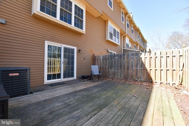 deck featuring central AC unit and fence