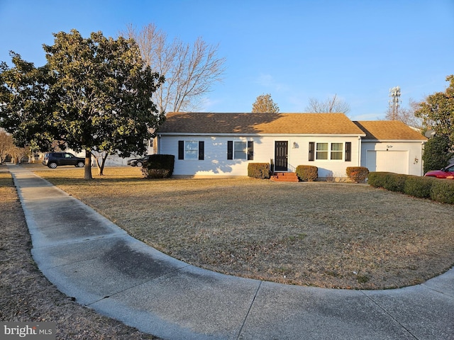 ranch-style house with a front lawn and an attached garage