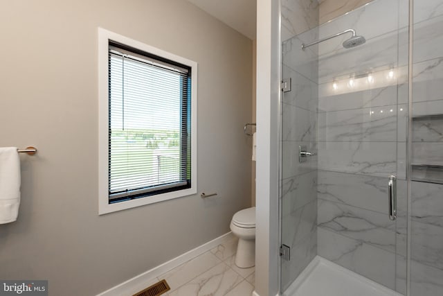 bathroom featuring marble finish floor, a marble finish shower, visible vents, toilet, and baseboards