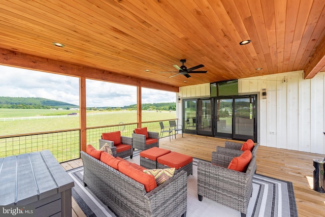 deck with ceiling fan and an outdoor hangout area