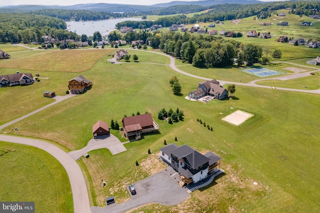 birds eye view of property with a rural view and a water view