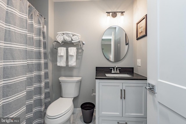 bathroom featuring toilet, marble finish floor, baseboards, and vanity