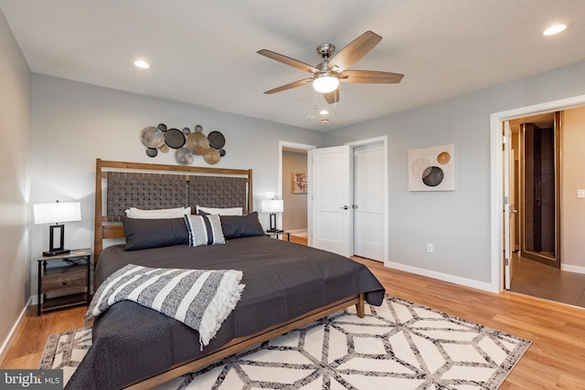 bedroom with recessed lighting, a closet, ceiling fan, wood finished floors, and baseboards