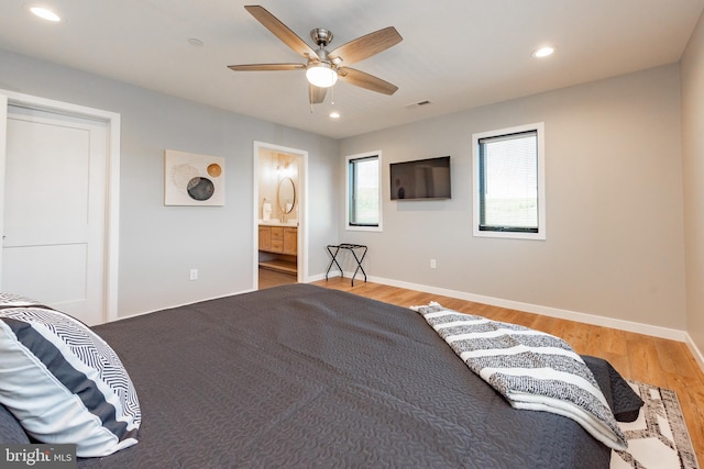 bedroom featuring light wood-style floors, baseboards, visible vents, and recessed lighting