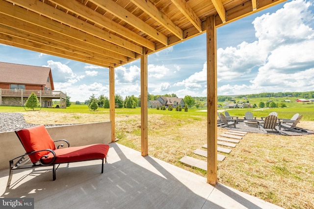 view of patio featuring an outdoor fire pit