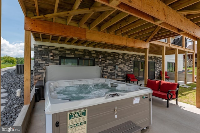 view of patio with a hot tub