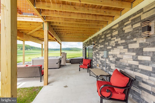 view of patio / terrace with a hot tub