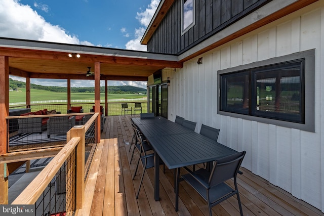 wooden deck with outdoor dining area