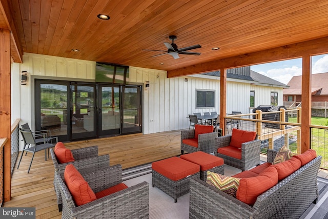 view of patio / terrace with ceiling fan, a wooden deck, and an outdoor hangout area