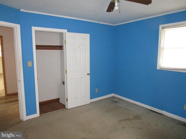 unfurnished bedroom with a ceiling fan, a closet, baseboards, and crown molding