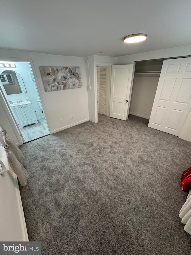 unfurnished bedroom with carpet and baseboards