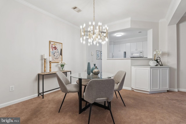 dining room featuring carpet flooring, visible vents, and crown molding