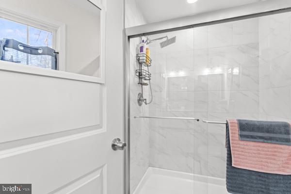 bathroom with a shower stall