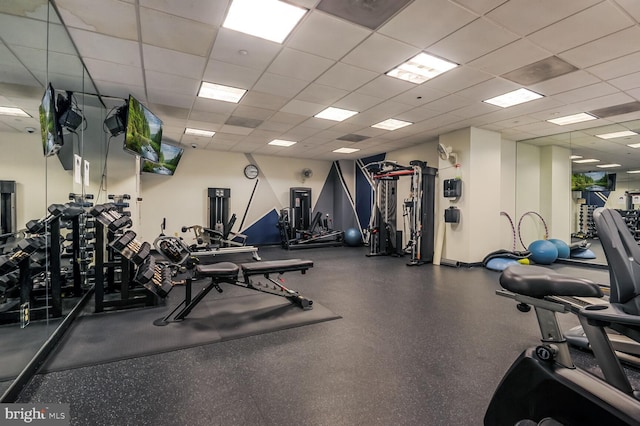 workout area featuring a drop ceiling