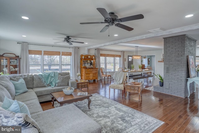 living room with recessed lighting, visible vents, wood finished floors, and a ceiling fan