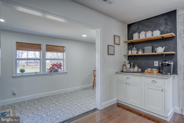 bar with recessed lighting, a dry bar, baseboards, and dark wood-style flooring