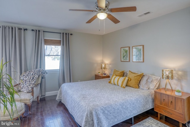 bedroom featuring a ceiling fan, hardwood / wood-style flooring, baseboards, and visible vents