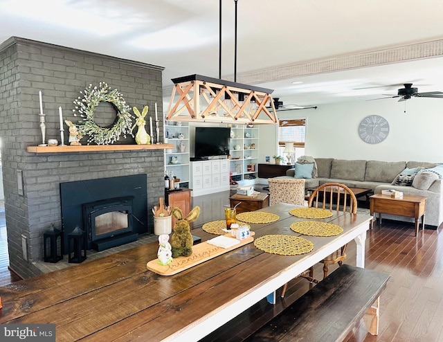 dining area with ceiling fan and wood finished floors