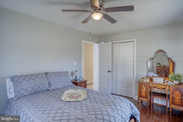 bedroom with a closet, a ceiling fan, and wood finished floors