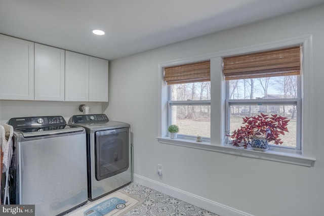 laundry area with cabinet space, recessed lighting, washer and dryer, and baseboards