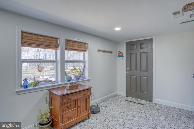 foyer featuring recessed lighting, visible vents, and baseboards